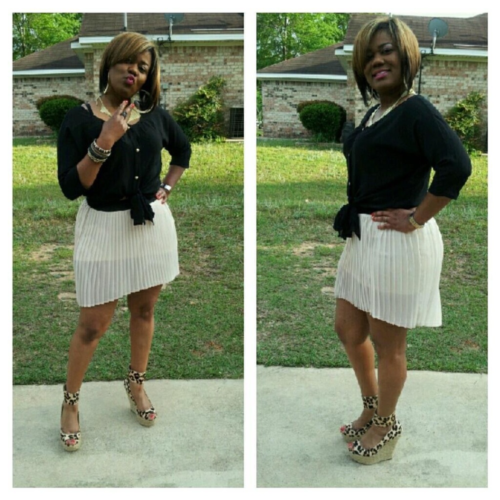 Pleated asymmetric skirt